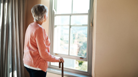 Elderly woman at window